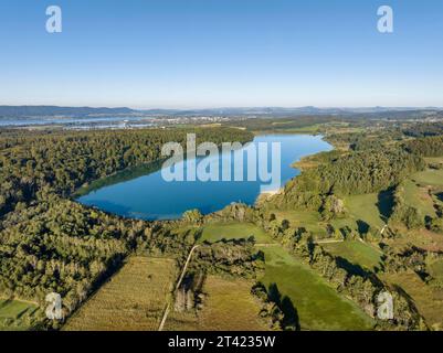 Aerial view of Mindelsee, a glacial tongue lake on the Bodanrueck, on the horizon on the left the western part of Lake Constance with the town of Stock Photo