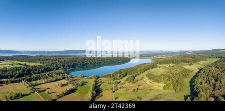 Aerial panorama of Mindelsee, a glacial tongue lake on the Bodanrueck, on the horizon the western Lake Constance with the Mettnau peninsula and the Stock Photo