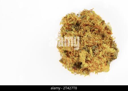 pile of calendula flowers, Calendula officinalis, dried, isolated on white background and copy space. Stock Photo