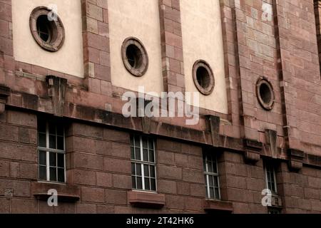 A modern high-rise building featuring numerous circular windows Stock Photo