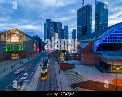 Aerial, tram and Deansgate Square, and The Manchester Central Convention Centre (G-MEX), Manchester city centre at night, England Stock Photo