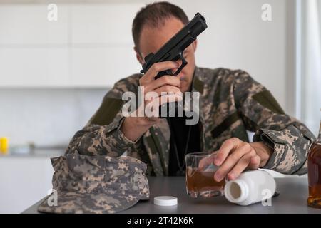 Portrait of middle aged sad, desperate military man. Disabled soldier suffering from depression psychological trauma. PTSD concept. Stock Photo