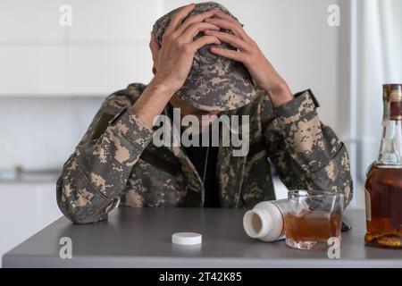 Portrait of middle aged sad, desperate military man. Disabled soldier suffering from depression psychological trauma. PTSD concept. Stock Photo
