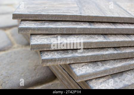 sale of ceramic tiles close-up, several tiles laid on a heap Stock Photo
