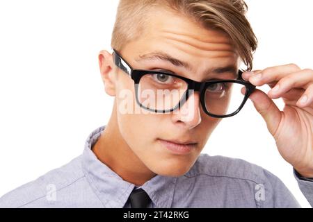 Spectacles, vision and portrait of man in a studio with confused, doubt or squinting facial expression. Optometry, health and young male person with Stock Photo