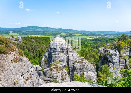 Panoramic view of a sandstone rock city in Bohemian Paradise, Czech: Cesky raj. Sfinga rock tower in Hruba skala rock city town. Climbers on top. Czech Republic Stock Photo
