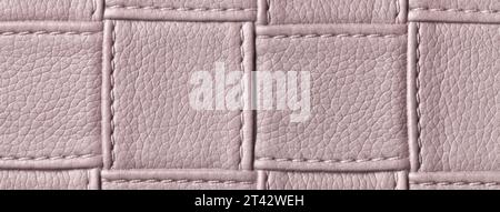 Texture of brown leather background with square pattern and stitch, macro. Abstract backdrop from modern decorative light umber textile with geometric Stock Photo