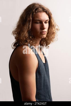 Thinking, casual and man with ideas, vest and confident guy on a white studio background. Person, guy and model with fashion, solution and daydreaming Stock Photo