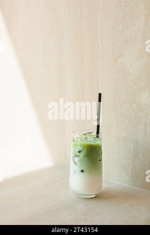 Close-up of a matcha latte on a marble table Stock Photo