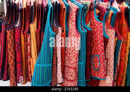 Traditional clothing for sale in Dilli Haat craft market, New Delhi, India Stock Photo