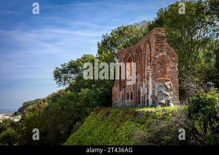Trzesacz, Poland - September 19, 2023: Ruins of medieval church on Baltic sea coast, collapsed as see took away the land. Stock Photo
