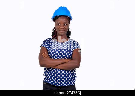 portrait of a beautiful young serious female construction engineer crossing her arms. Stock Photo