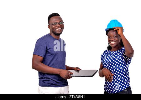 young man holding laptop and happy engineer woman while smiling. Stock Photo