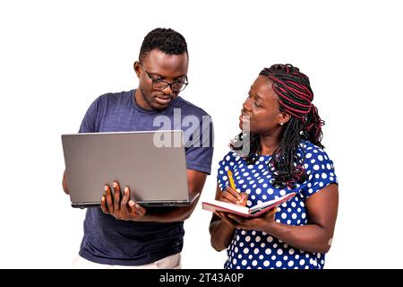young businessman and his secretary working together. secretary taking notes in the boss's notebook. Stock Photo