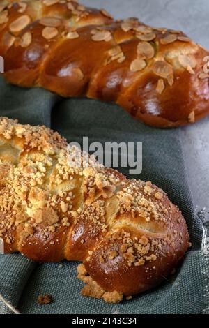 Two Challah breads with almond and sweet crumble in a macro vertical shot. Stock Photo