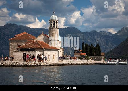 Our Lady of the Rocks sits on an island in of the Bay of Kotor off shore from Perast, Montenegro. Stock Photo