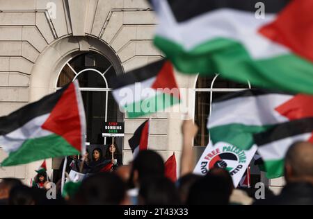 Leicester, Leicestershire, UK. 28th October 2023. A protester holds a placard during a pro-Palestinian demonstration. Tens of thousands of pro-Palestinian protesters have gathered in London and across the UK for rallies urging an end to Israel's attacks in Gaza. Credit Darren Staples/Alamy Live News. Stock Photo