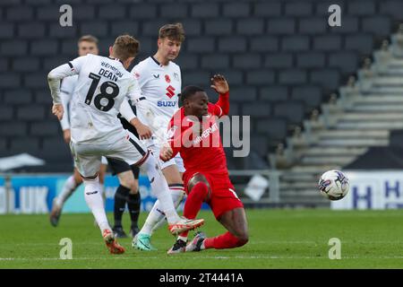 Milton Keynes Dons Max Dean is tackled by Swindon Town's Rushian Hepburn-Murphy during the second half of the Sky Bet League 2 match between MK Dons and Swindon Town at Stadium MK, Milton Keynes on Saturday 28th October 2023. (Photo: John Cripps | MI News) Credit: MI News & Sport /Alamy Live News Stock Photo