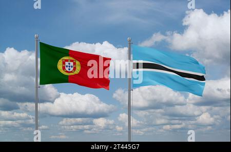 Portugal and Botswana flags waving together in the wind on blue cloudy ...