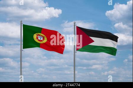 Palestine and Gaza Strip and Portugal flags waving together on blue cloudy sky Stock Photo