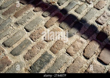 Close-up of a brick road in a very old part of a city Stock Photo