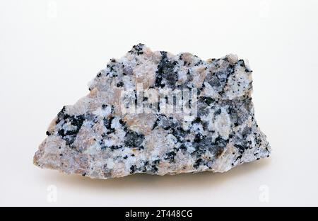 Pink granite. Granite is an igneous intrusive rock with holocrystalline texture. Sample. Stock Photo