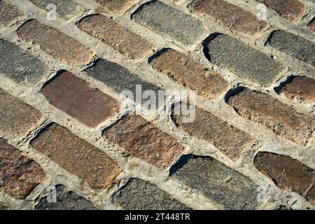 Close-up of a brick road in a very old part of a city Stock Photo