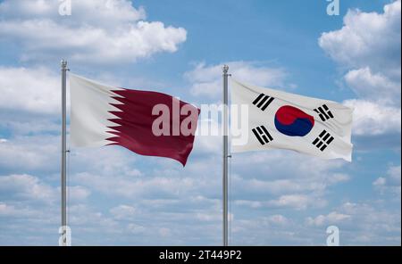 South Korea or Republic of Korea or ROK and Qatar flags waving together in the wind on blue cloudy sky, two country relationship concept Stock Photo