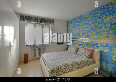 Modern bedroom with wall painted, Italy Stock Photo