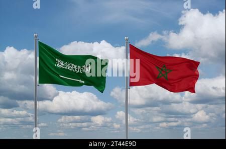 Morocco and Saudi Arabia flags waving together on blue cloudy sky, two country relationship concept Stock Photo