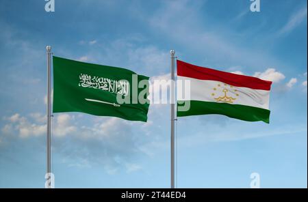 Tajikistan and Saudi Arabia flags waving together in the wind on blue cloudy sky, two country relationship concept Stock Photo