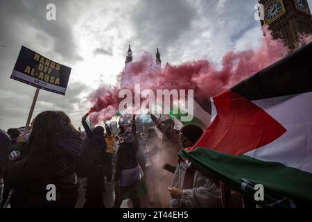 An estimated 100,000 people take part in the Free Palestine and anti- Middle Eastern invasion of Gaza Protest across Westminster, London, UK Stock Photo