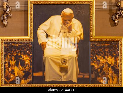 GENOVA, ITALY - MARCH 6, 2023: The painting of pope St. John Paul II at the prayer in the church Chiesa di Santa Caterina by Elizabeth Cyran (2006). Stock Photo