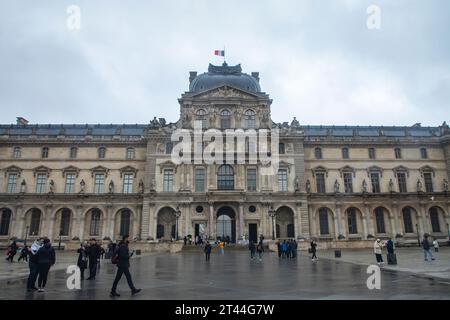 Visitors outside the Louvre art gallery and Museum entrance Paris France EU Europe. Stock Photo