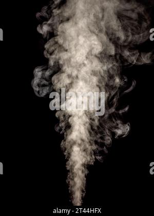 White smoke isolated on a black background, rising in balls as an abstract effect Stock Photo