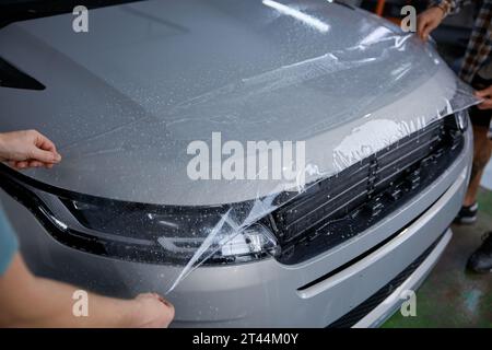 Car Service Worker Applying Nano Coating On A Car Detail. Stock Photo,  Picture and Royalty Free Image. Image 157047491.