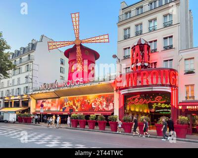 Moulin Rouge cabaret theatre at dusk, Place Blanche, Boulevard de Clichy, Pigalle District, Paris, Île-de-France, France Stock Photo