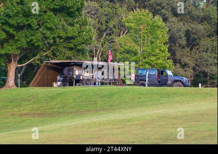 Burkesville, KY - August 11, 2023: Small teardrop travel trailer parked on a hill at Dale Hollow State Park Campground Stock Photo