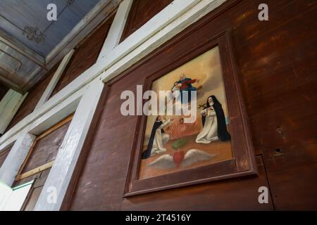 An allegorical painting adorns the rustic walls of the Mission of the Sacred Heart in Old Mission State Park, Cataldo, Idaho. Constructed between 1850 Stock Photo