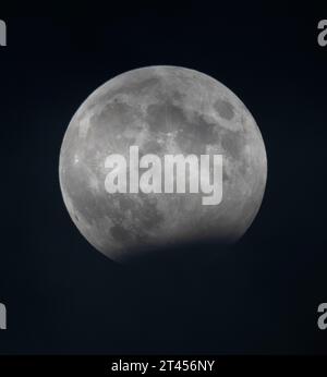 London, UK. 28th Oct, 2023. Partial lunar eclipse at its almost full extent seen from London, at 21:09pm. Credit: Malcolm Park/Ģ����ý Live News Stock Photo