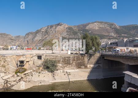 Damaged dam, broken concrete, river. Turkish city Antakya in Hatay province, earthquake aftermath. Turkey Stock Photo