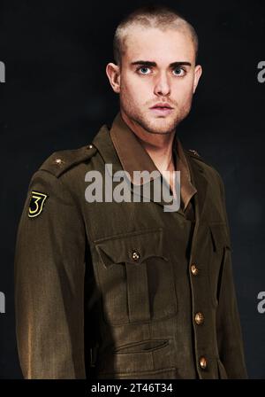 Soldier, portrait or man with ptsd, serious or surprised face with fear, terror and anxiety for mental health. Man, guy or wide eyes with addiction Stock Photo
