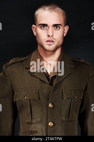 Military, portrait or man with ptsd, serious or surprised face and fear, terror and anxiety in studio. Man, guy or wide eyes with addiction, user or Stock Photo