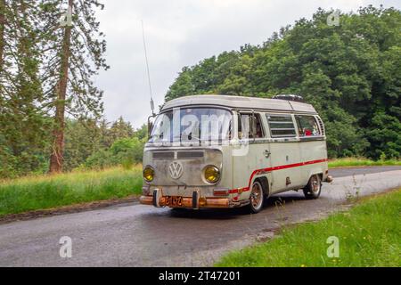 1971 70s seventies white rusty VW Volkswagen Westfalia camper van,  en-route KLMC at ‘The Cars the Star Show” in Holker Hall & Gardens, Grange-over-Sands, UK Stock Photo