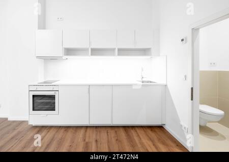 build in kitchen or kitchenette in new apartment room Stock Photo