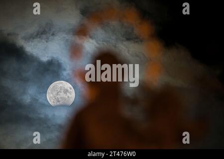 Ivancice, Czech Republic. 28th Oct, 2023. A partial lunar eclipse is seen in Ivancice, Brno-Country District, Czech Republic, on October 28, 2023. Credit: Patrik Uhlir/CTK Photo/Ģ����ý Live News Stock Photo