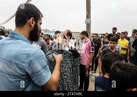 Rafah, Palestinian Territories. 29th Oct, 2023. Palestinians stand near the destroyed house belonging to the Al-Maghari family after an Israeli airstrike on Rafah, southern of the Gaza Strip. Credit: Abed Rahim Khatib/dpa/Alamy Live News Stock Photo