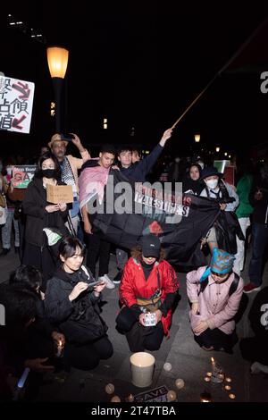 Tokyo, Japan. 29th Oct, 2023. October 29, 2023: Pro-Palestine demonstrators hold a candlelight vigil outside Tokyo Station in Marunouchi to mourn civilian non-combatant victims of Israeli airstrikes amid the IDF's invasion of the Gaza Strip. The anti-war demonstrators are calling for a cease-fire following Israel's response to a ground incursion by Hamas militants into Israel. (Credit Image: © Taidgh Barron/ZUMA Press Wire) EDITORIAL USAGE ONLY! Not for Commercial USAGE! Credit: ZUMA Press, Inc./Alamy Live News Stock Photo