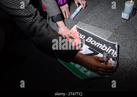 Tokyo, Japan. 29th Oct, 2023. October 29, 2023: Pro-Palestine demonstrators hold a candlelight vigil outside Tokyo Station in Marunouchi to mourn civilian non-combatant victims of Israeli airstrikes amid the IDF's invasion of the Gaza Strip. The anti-war demonstrators are calling for a cease-fire following Israel's response to a ground incursion by Hamas militants into Israel. (Credit Image: © Taidgh Barron/ZUMA Press Wire) EDITORIAL USAGE ONLY! Not for Commercial USAGE! Credit: ZUMA Press, Inc./Alamy Live News Stock Photo