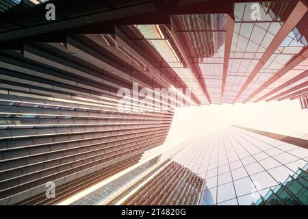 Architectural detail. Geometric abstract background of windows and reflections at sunset. Warm pink tones, Business background. Stock Photo
